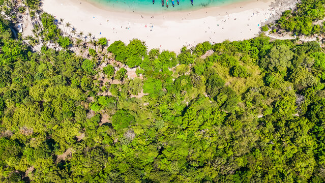 Stunning aerial view of the beach. An aerial photograph of the beautiful tropical beach and sea on Phuket Island. Located at Freedom Beach, Phuket, Thailand, at 10 am &ndash; the start of sunbathing, summer