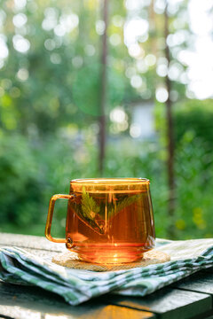 Herbal detox tea in glass mug for natural urinary care