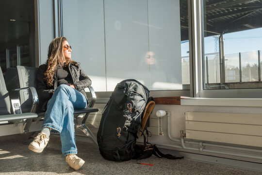 Traveler waiting at station with backpack