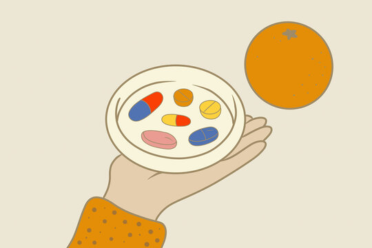 Hand holding a plate with assorted pills and an orange