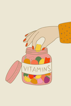 Hand taking vitamins from a jar for health