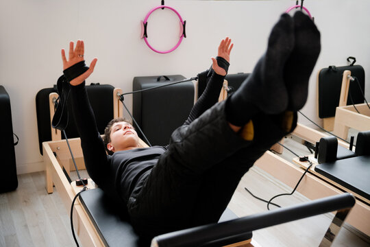 Pilates reformer workout with leg and arm training