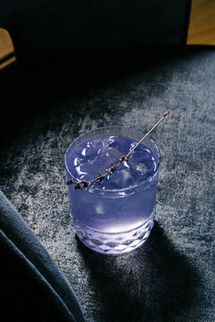 Lavender gin and tonic cocktail with butterfly pea and ice