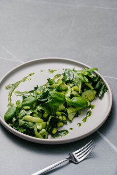 Super greens salad with avocado, edamame and basil dressing