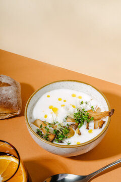 Creamy mushroom and parsnip soup with roasted garnish