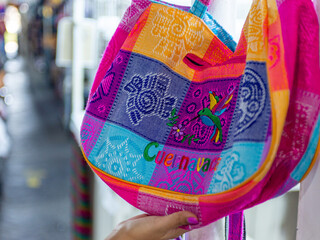 Naklejka premium Close up of a vibrant handcrafted souvenir bag from Cuernavaca, Mexico.