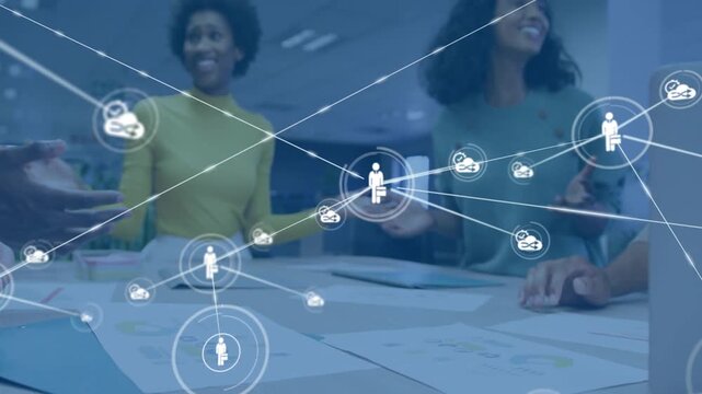 Vertical video: Single icon popping business team checking docs at table to align, stacking hands