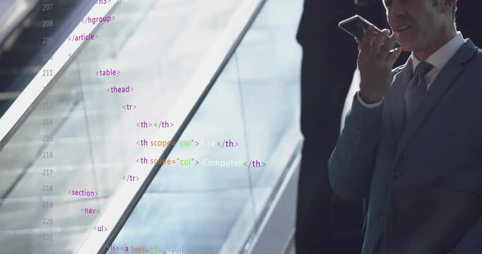 Talking man in suit speaking into smartphone in lobby with glass escalator railing and code overlay