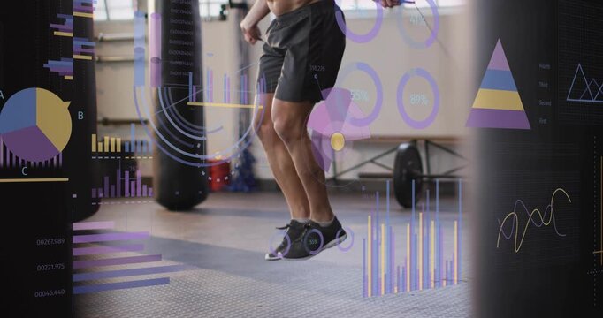 Athlete jumping rope in gym, camera starting feet, zooming out, fitness charts tracking training