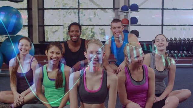 Vertical video: Reacting to camera start, group in studio in gymwear giving thumbs up by blue balls