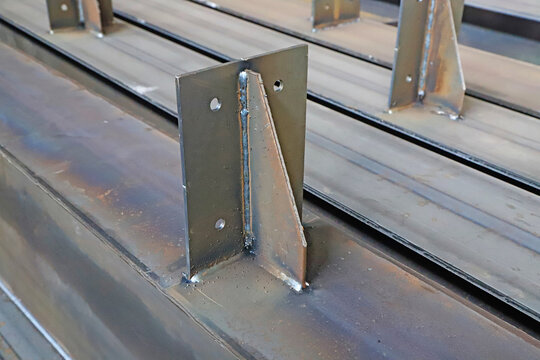Close-Up of Welded Steel Bracket on Structural Beam in Industrial Workshop
