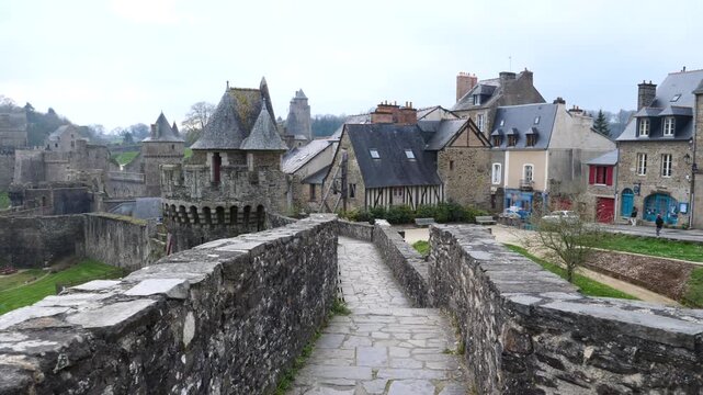 A view of the fortification and the old Castle of Fougères on a cloudy day. Fougères, France - March 25, 2025. 