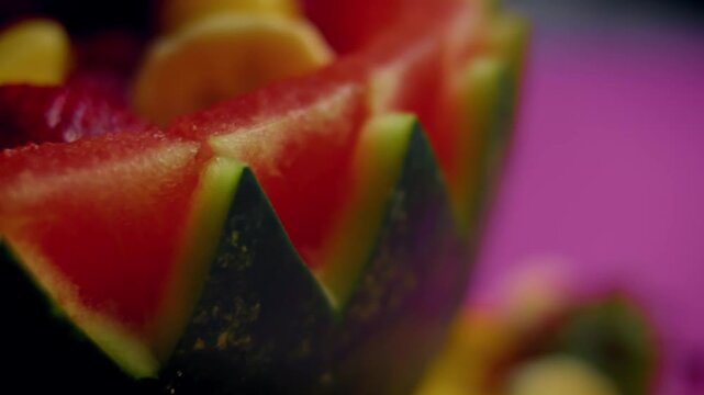 The edge of the carved watermelon basket is cut in a zigzag pattern