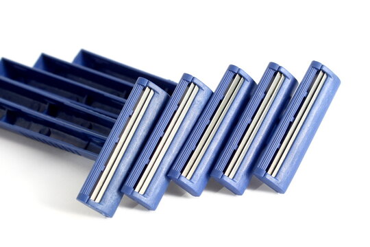 Several men's razors lie on a white background.