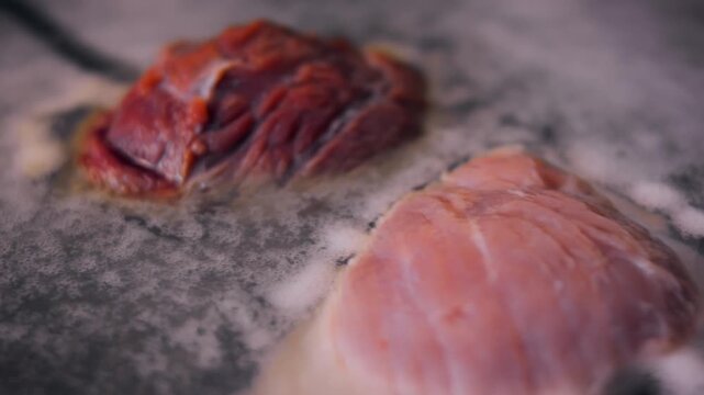 Foam appears as the meat cooks in the water