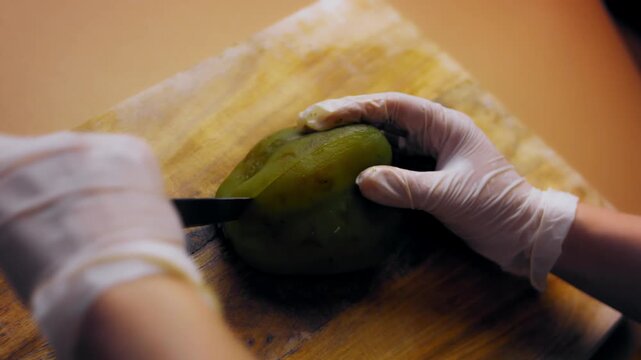 The peeled roasted pepper is cut lengthwise