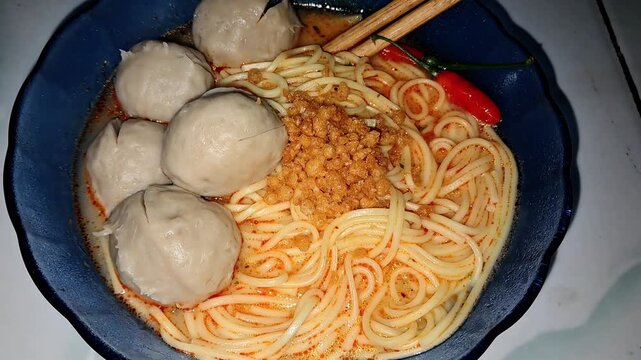 Indonesian Meatball Noodle Soup (Bakso) with Spicy Broth and Crispy Garlic