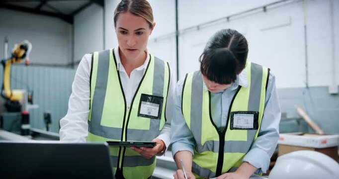 Women, engineer and meeting with tablet at warehouse for planning, machine update and advice. Team, laptop and writing notes on production, automation safety and diagnostics report for manufacturing