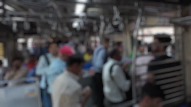 Bokeh view of passengers in suburban train , Mumbai, India. Blurred background footage.