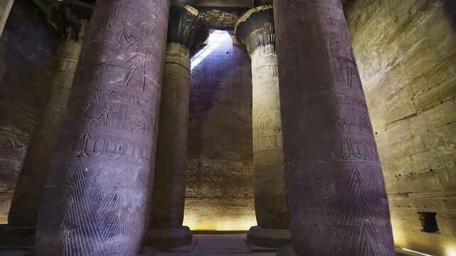 Temple of Edfu with massive carved columns and detailed hieroglyphs, revealing the atmosphere of Ancient Egyptian architecture and sacred space. Egypt.