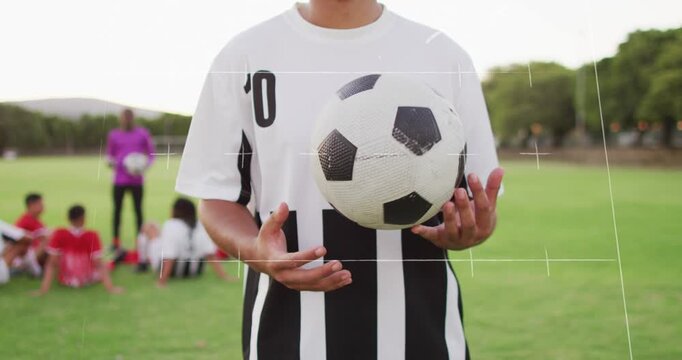 Animation of game plans over diverse football players at stadium