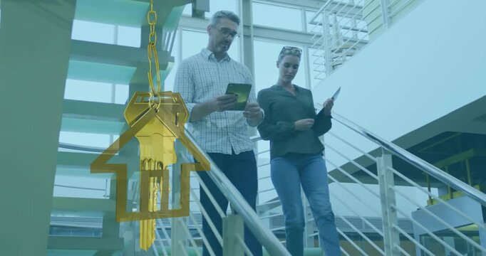Animation of gold house key and key fob over diverse businesspeople