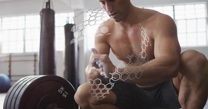 Shirtless gym user chalking hands at barbell, activating honeycomb overlay, securing deadlift grip