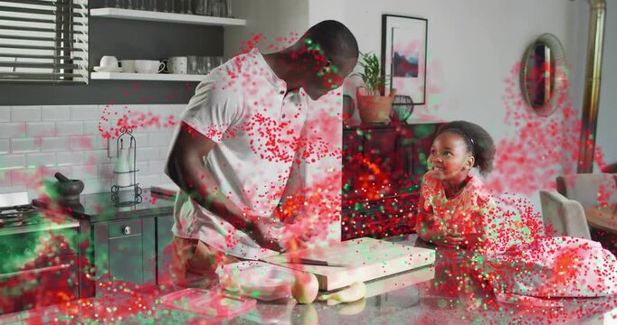 man entering kitchen using knife daughter watching slicing apple banana into box for school snack
