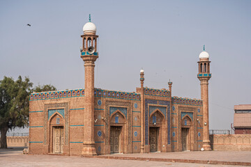 Fototapeta premium Landscape view of ancient brick mosque in courtyard of historic landmark Shah Rukn-e-Alam mausoleum and shrine, Multan, Punjab, Pakistan