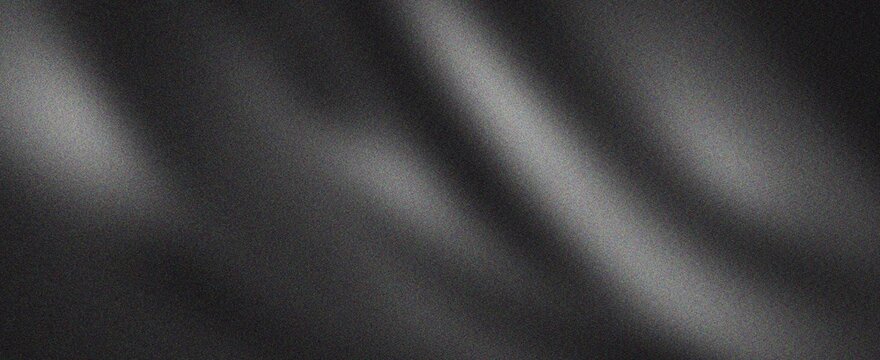 Dark charcoal fabric ripples with subtle grainy noise and soft highlights.