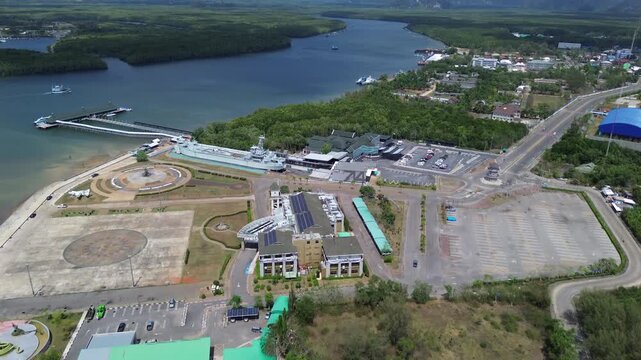 Aerial view of the HTMS Lanta warship museum featuring a decommissioned naval ship and aircraft display near Klong Jilad Ferry Pier in Krabi Thailand coastal area.
Surrounded by stunning nature.