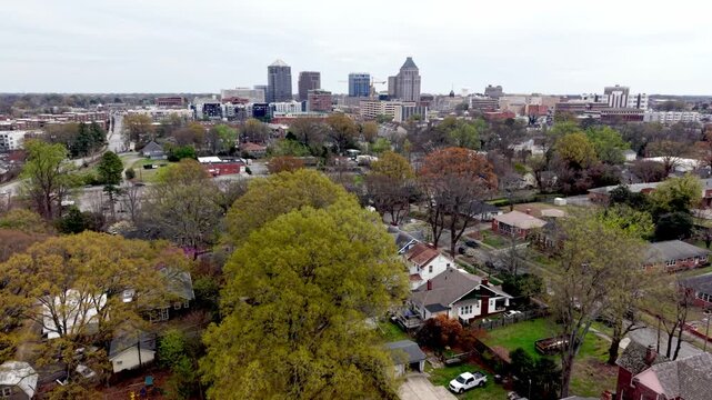neighborhoods and homes in suburbs of greensboro nc, north carolina aerial treetop pullout