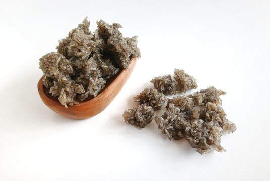 Close-up of anchovy rice crackers, known as rengginang teri, a traditional Indonesian savory snack made from glutinous rice and small anchovy fish. 