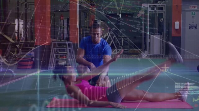 A young woman of exercising with a young man of who is her personal trainer th