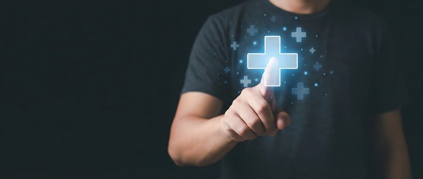 Person's hand is pointing at a glowing digital plus sign, symbolizing concepts like adding value, healthcare, or positive growth and solutions in various fields.