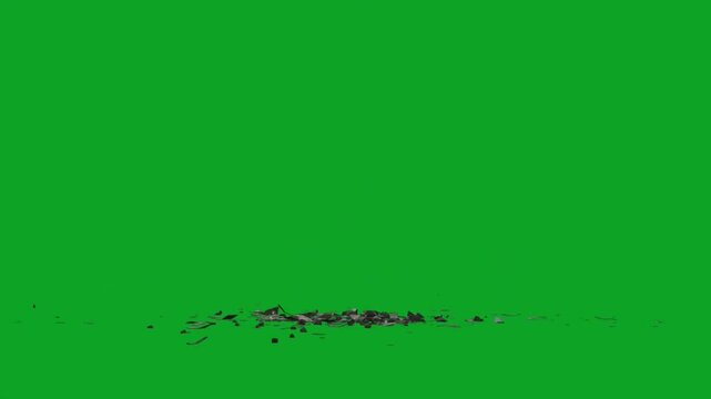 Broken black ceramic plate shattering on green screen floor in slow motion effect