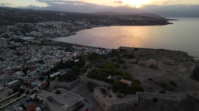 Beautiful aerial view showing the fortezza of rethymno in crete, greece, during a golden sunset