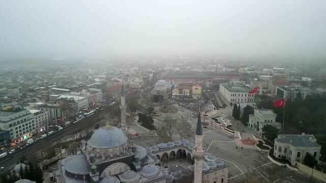 Istanbul/Turkey circa 2023: Beyazit Mosque in Istanbul cityscape flying forward
