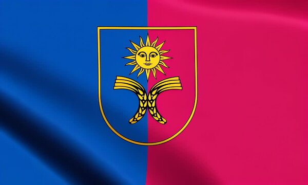 The Flag of Khmelnytskyi Oblast waving gently with a shield emblem featuring a sun and wings on a blue and pink background.