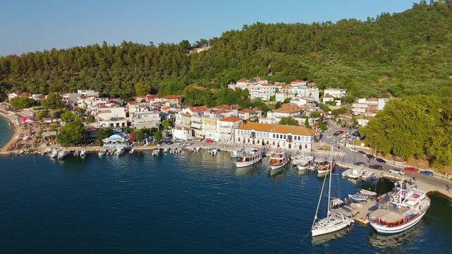 Aerial View of Limenas Beach with People Swimming in Thasos Greece