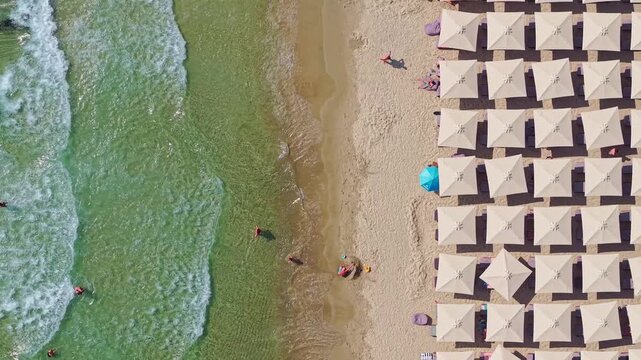 Aerial View of Beach Umbrellas and Waves at Paradise Beach, Thasos, Greece