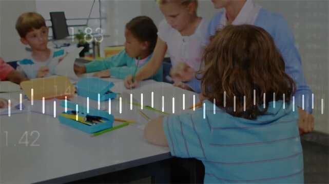 Girl in wheelchair tapping tablet accessing waveform, teacher guiding students writing for learning