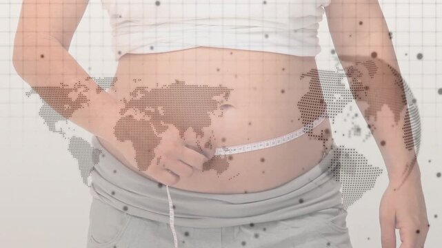 Woman lifting cropped top, wrapping tape around waist for health, dotted map and grid over torso