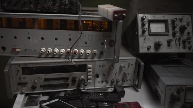 Old Audio Equipment And Workspace. Salvage Workshop Showcasing Classic Audio Gear And Repair Tools . Media