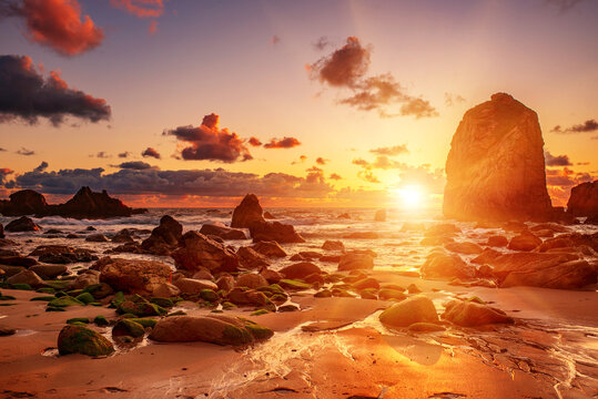 Praia da Ursa beach, Sintra-Cascais Natural Park, Portugal, cliffs in the sea at sunset
