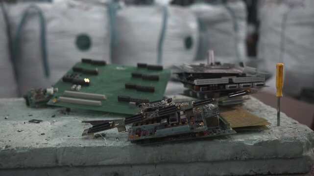 Discarded Circuit Boards And Repair Tools. Industrial Workspace With Damaged Motherboards And Components . Media