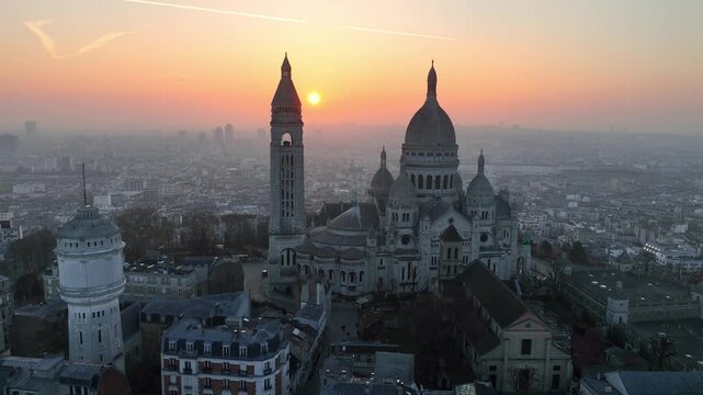 drone shot of Sacre Coeur basilica in Montmartre, Paris, aerial view sunrise of the basilica of the Sacred Heart in the capital of France, Paris