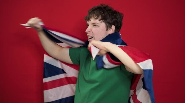 A football fan rejoices at his team's victory and shouts hurray.