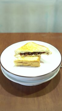 Delicious Golden Brown Chocolate Grilled Sandwich on Rotating Plate