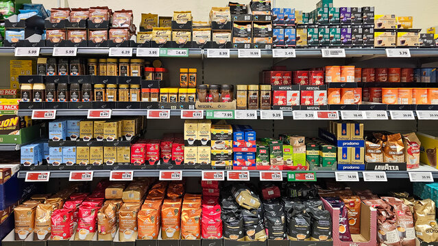 Menden, NRW, Germany - October 29, 2025 Various coffee brands and types displayed on supermarket shelves with price tags